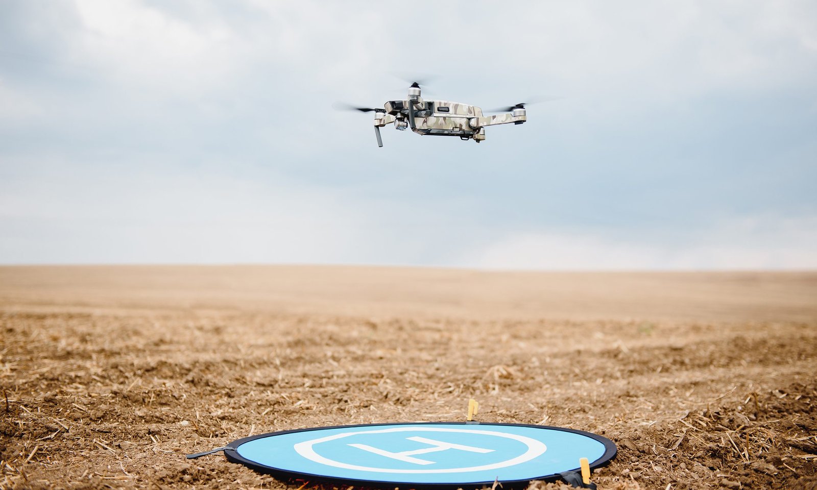 Drone flying during the day in field. The use of drones in the agricultural business